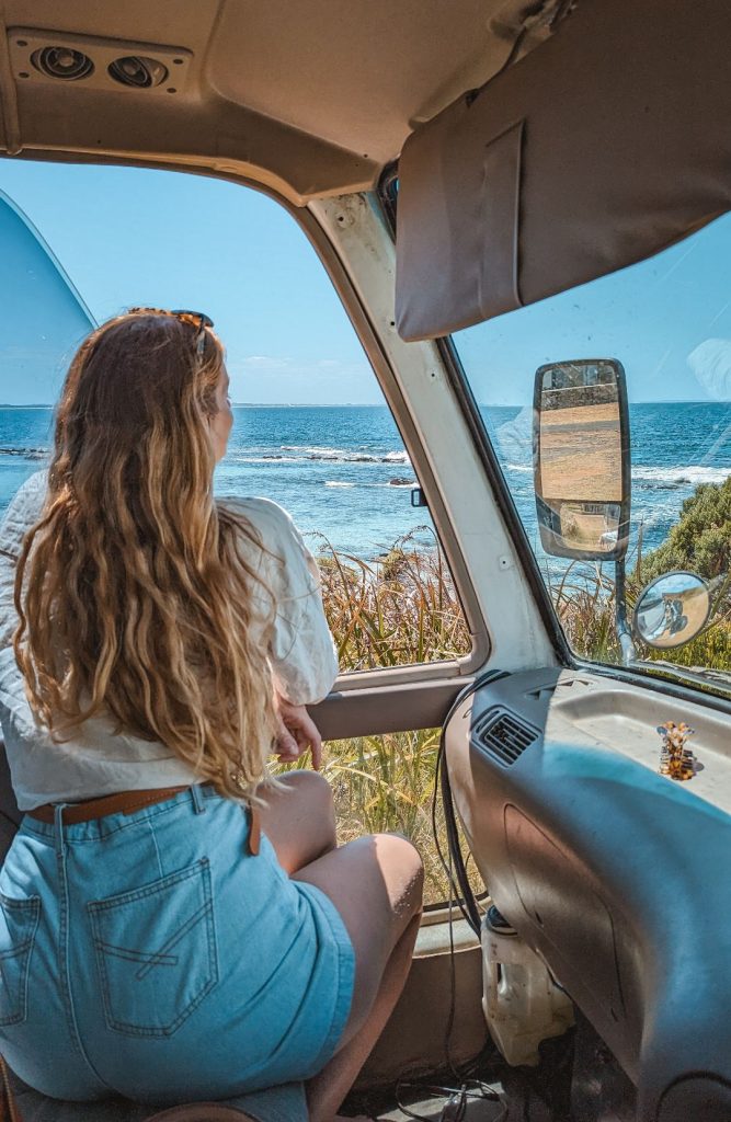 woman looking out the window of a van into the sea in granny's pool augusta western australia
