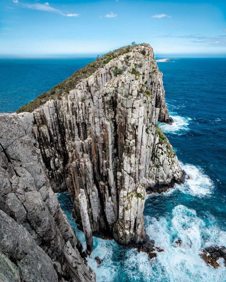 Rugged dolerite cliffs plunge into the sea at Cape Hauy, part of the dramatic coastline seen on the Three Capes Track for free.
