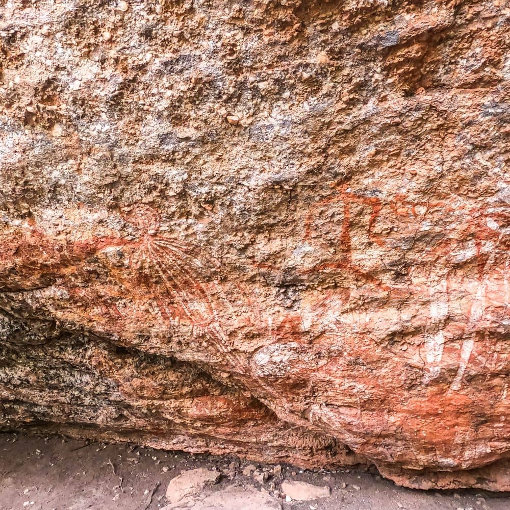 Traditional rock art done by Indigenous Australians. This beautiful artwork is one of the unmissable activities to see in Kakadu. This is the Aboriginal rock art at Burrungkuy.