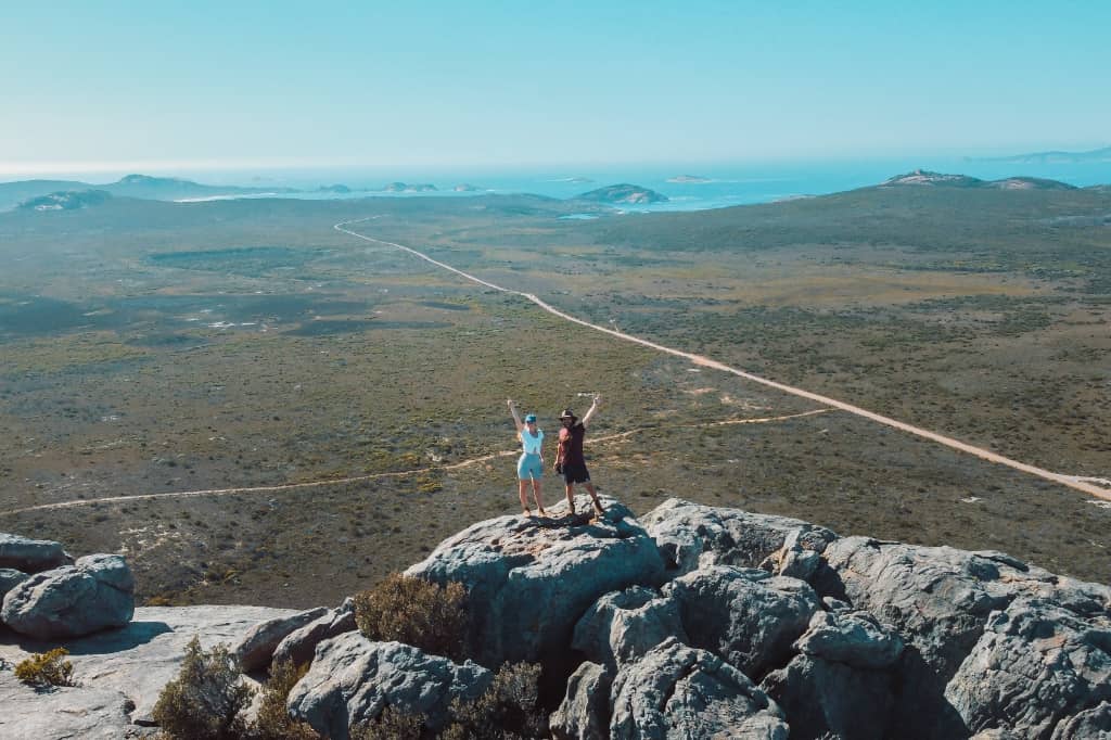 Two people standing at the top of Frenchman Peak in Esperance, Western Australia
