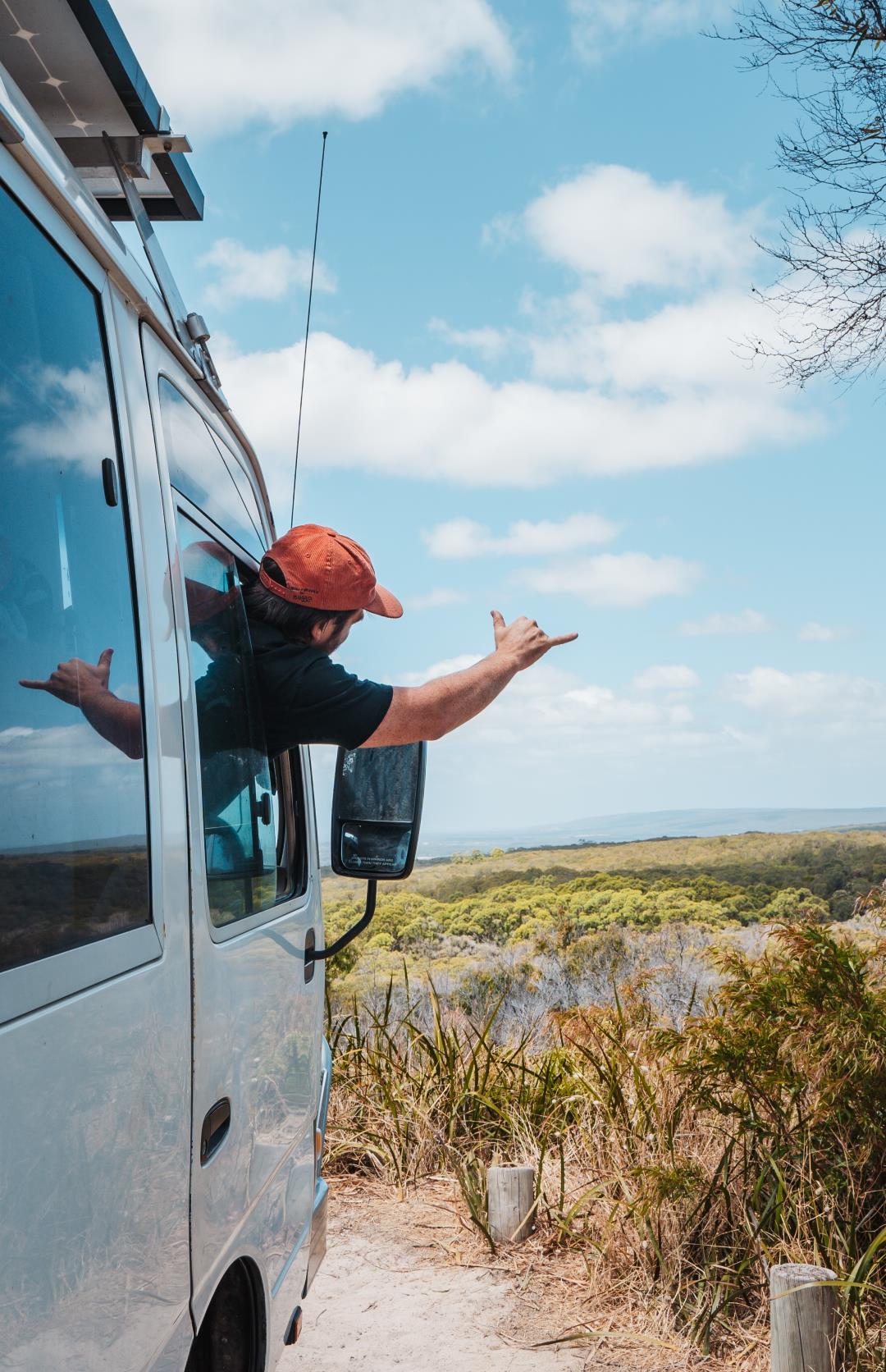 A man riding a camping van going to Margaret River Towns showing the amazing things to do in Margaret River, Western Australia